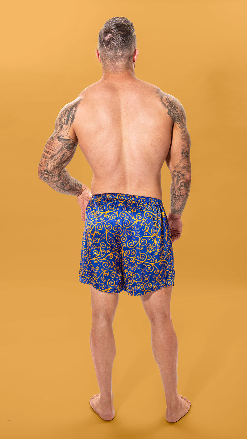 Boxer Gold Swirls on Cobalt Sky.